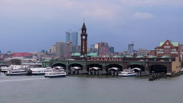 Aerial view of Hoboken Terminal with its iconic clock tower and the surrounding neighborhood in New Jersey at dusk