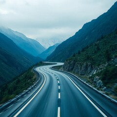 High-resolution stock photo of a winding highway through a mountainous region, commercial use, professional quality, displaying a dramatic perspective with cool blues and greens, featuring sharp curve