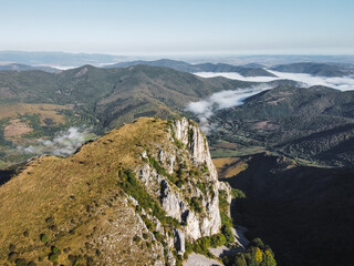Misty Morning in the Romanian Mountains – Aerial View of Foggy Hills and Rocky Cliffs