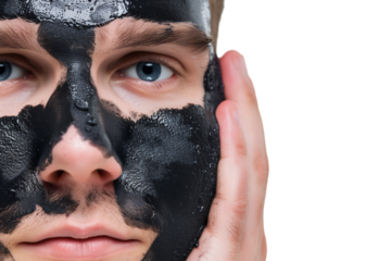 Man applying charcoal cleanser on face to remove soot on a white or transparent background
