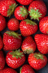 Strawberries as a background. Closeup view group of strawberries