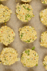 Raw soy pattiesA top-down shot of raw soy patties arranged on parchment paper, ready for baking, showcasing their textured surface and visible ingredients