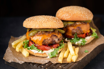 Classic cheeseburgers served with french fries