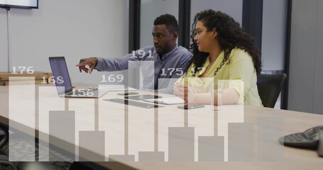 Image of financial data processing over diverse colleagues discussing work in office
