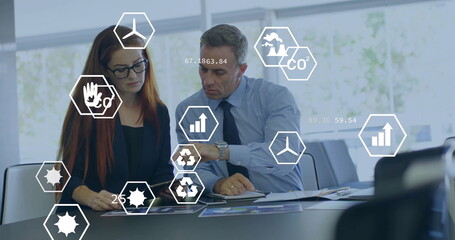 Image of eco icons and data processing over diverse business people in office