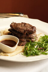 Steak, salad, and cocktail on a restaurant table. Delicious meal, fine dining, food photography....