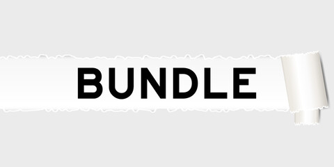 Ripped gray paper background that have word bundle under torn part