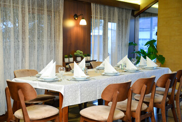 February 23, 2025 - Belgrade, Serbia. Restaurant interior with set dining utensils.