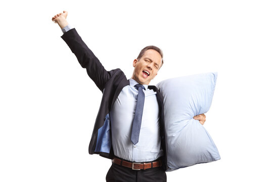 Businessman holding a pillow and stretching