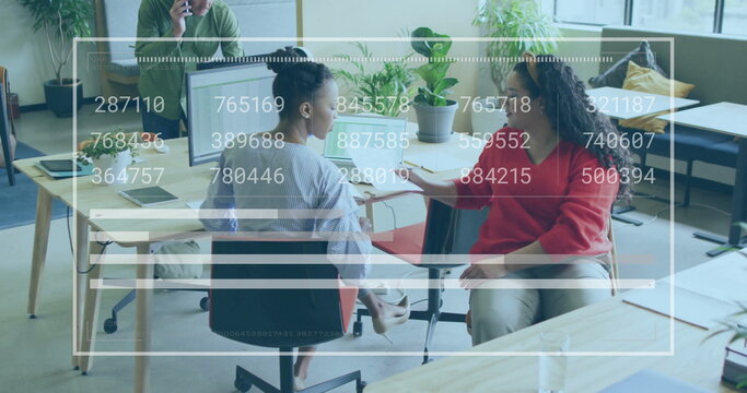 Image of financial data processing over diverse business people in office