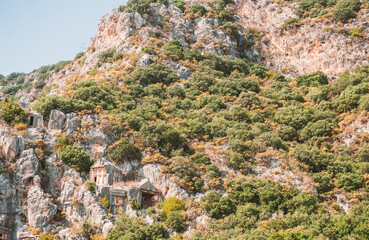 Ruins of old lycian rock tombs in ancient Myra city near town Demre, Turkey