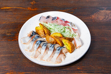 Fresh seafood platter with assorted fish and roasted potatoes