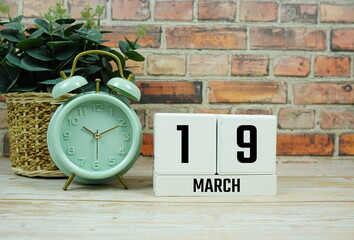 Wooden Calendar Showing the Date of March 19th. Day 19 of March month