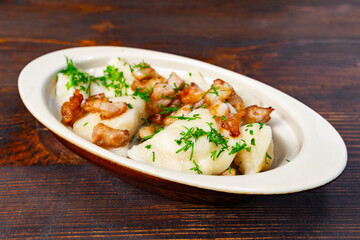 Delicious potato dumplings served with crispy bacon bits