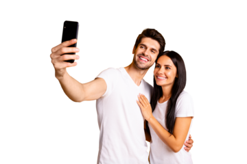 Photo of two people holding telephone in hand taking selfies for new post wear casual clothes isolated yellow color background