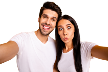 Photo of two people in foolish mood taking selfies sticking tongue making faces wear casual clothes isolated yellow color background