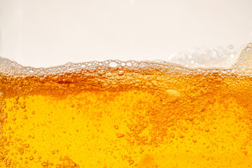 Close up bright orange Oil or beer splash texture and nature waves, Beautiful waves curve and...