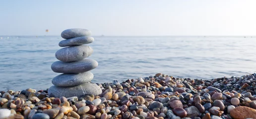 Fotobehang Zen Stenen Spa stones balance on the sand of the beach.  © Swetlana Wall