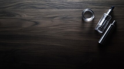 Vaping device on a dark wooden surface with a small glass bottle. Featuring modern minimalism and calm