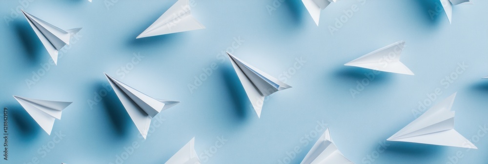Poster minimalist paper plane art display dynamic origami flight paths on geometric blue backdrop - creativ