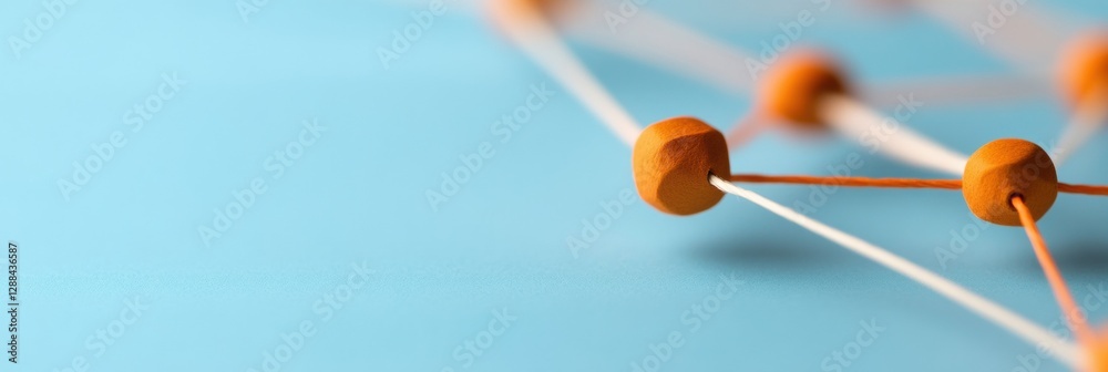 Leinwandbilder geometric network visualization orange wood nodes and string on blue surface for business innovation
