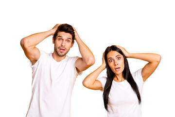 Photo of nice couple holding hands on head not believe bad news wear casual white t-shirts isolated...