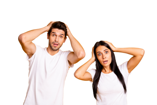 Photo of nice couple holding hands on head not believe bad news wear casual white t-shirts isolated yellow color background