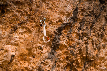Beautiful road among the rocky yellow-red mountains on the southern mediterranean coast in the rays of the sun at sunset.