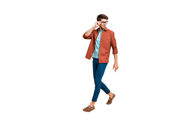 Naklejka premium Full length body size view of his he nice attractive fashionable calm brunet guy business shark expert specialist touching specs walking isolated over beige color pastel background