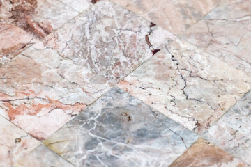 Detailed view of a tiled marble floor surface