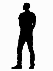 Man is standing in front of a white background. He is wearing a black shirt and black pants
