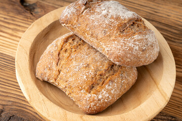 Brown rye bun, square gluten free bread, whole grain healthy breakfast bread