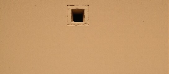 Shindagha-style Dubai house with rustic sandy-brown textured walls