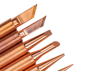 Copper tips of various shapes for soldering iron. Soldering tools isolated on white background.