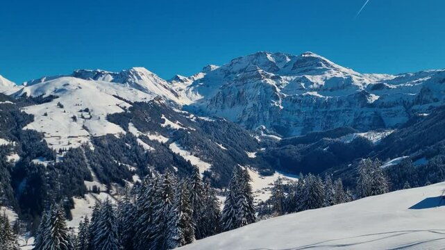 A stunning shot of the enchanting alpine winter landscape, highlighting the majestic Mount Wildstrubel in the Bernese Alps, Switzerland, with snow-capped peaks and a breathtaking view