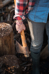 Farmer woman holding axe celebrating international workers' day