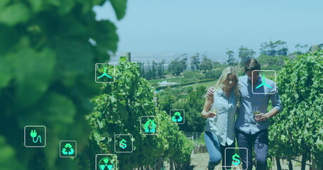 Image of network of eco icons over caucasian couple in vineyard