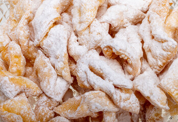Angel wings (Faworki), cakes. Sweet pastry deep fried and sprinkled with powdered sugar