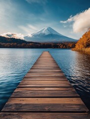 Wooden pier on lake with mountain backdrop