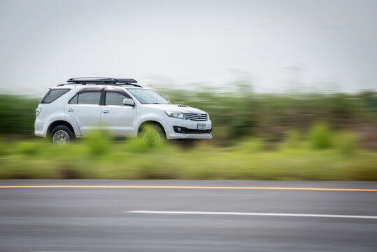 Nakhonsawan, Thailand - June 2024: Toyota Fortuner, A white car to speed running on the highway, on June 24, 2024, at Nakhon Sawan, Thailand.