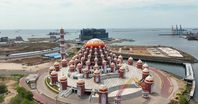 Aerial view & drone shot of a large beautiful mosque / Masjid Kubah 99 Asmaul Husna / September 2024: Makassar - Sulawesi - Indonesia / 4K, UHD