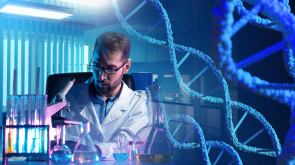 Man geneticist with microscope. Laboratory technician studies genome. Doctor is engaged in DNA...