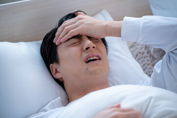 体調不良の日本人男性
