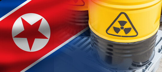 Flag of North Korea. Barrel with nuclear fuel. Tanks with symbol of radioactivity. Nuclear fuel production in North Korea concept. State symbol of DPRK. Metal barrels with uranium from North Korea © Grispb