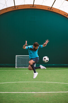 Cinematic image of a soccer freestyle player making tricks with the ball.