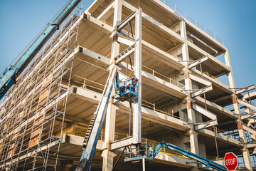 Construction Scene with Workers on a Scaffolding Lift