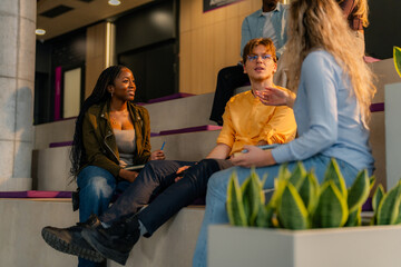 University students talking and studying together on campus