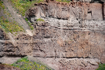Volcanic rock nature. Rock formation with erosion. Landscape with rock formation. Nature formation. Geological rock formation. Tourism and travel destination, Greece. Geology wall