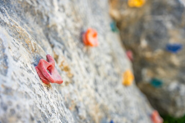 Close up view of a short rock climbing wall on the playground, concept of developing strength and coordination of children
