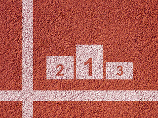 Podium for winners is depicted on asphalt. Place for tournament winners is drawn on running track....